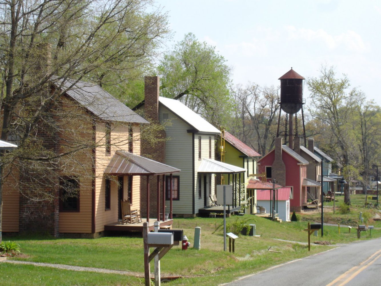 Restored mill houses line the streets in Glencoe along the MST on the Haw River. | Photo © Preservation NC